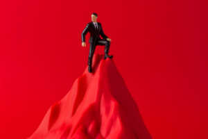 Business person at the top of a mountain